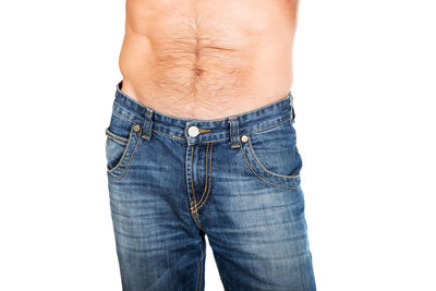 Midsection of man standing against white background