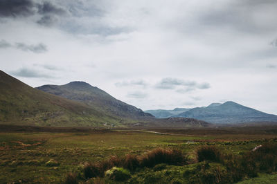 Scenic view of landscape and mountains against sky