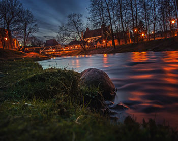 Scenic view of river against sky at night