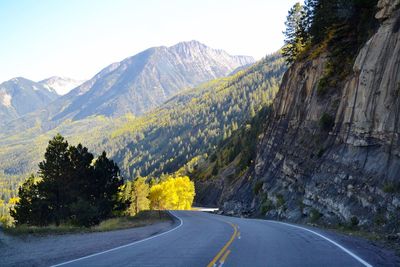 Road amidst mountains against sky