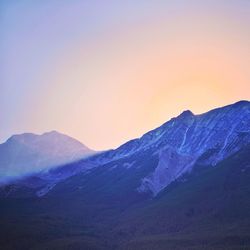 Scenic view of snowcapped mountains against clear sky