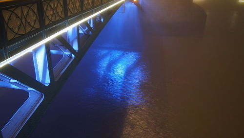 Illuminated bridge at night