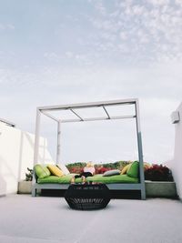 Tractor in basket against sky