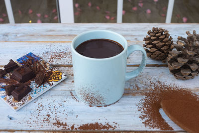 High angle view of coffee cup on table