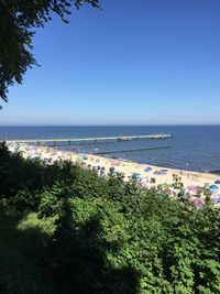 Scenic view of sea against clear blue sky