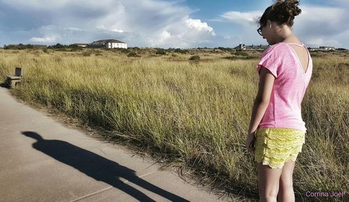 Woman standing on grass