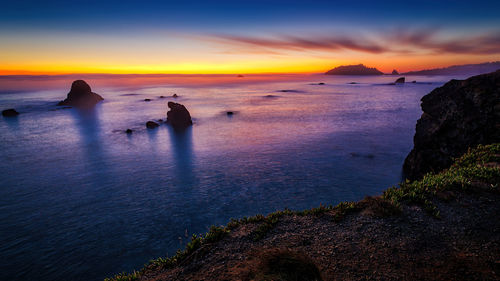 Scenic view of sea against sky during sunset
