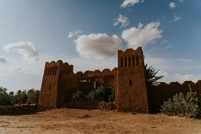 Old ruin building against cloudy sky