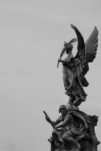 Low angle view of statue against sky