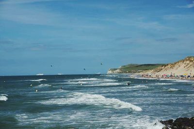 Scenic view of sea against blue sky