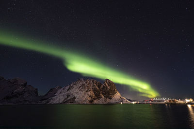 Scenic view of illuminated mountain against sky at night