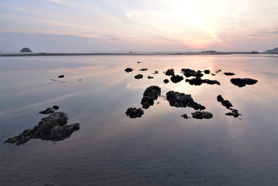 Scenic view of sea against sky during sunset