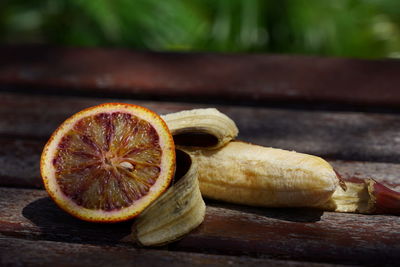 Close-up of orange slice on cutting board