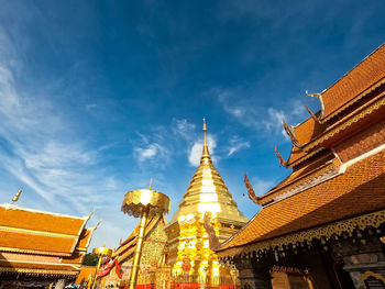 Low angle view of pagoda against buildings