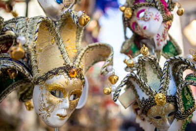 Close-up of decoration vintage masks for sale in market