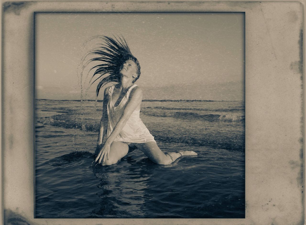 water, transfer print, sea, auto post production filter, lifestyles, leisure activity, standing, rear view, beach, person, young adult, young women, side view, three quarter length, horizon over water, nature, full length, shore