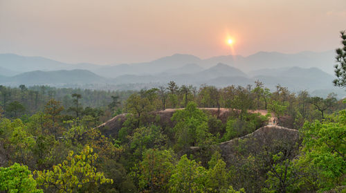 Scenic view of mountains against sky during sunset