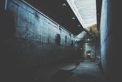 Illuminated walkway at night