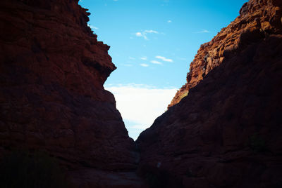 Low angle view of rock formations against sky