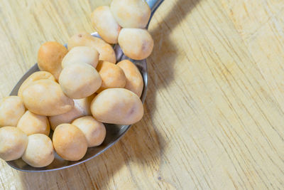 Close-up of peanuts in spoon on table