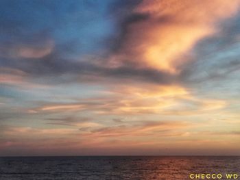 Scenic view of sea against sky at sunset