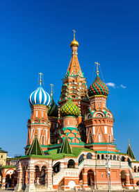 Low angle view of temple building against blue sky