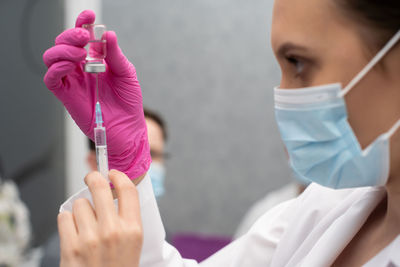 Close-up of doctor giving medicine