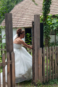 Woman standing by plants