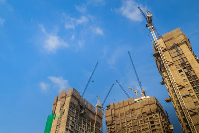 Low angle view of buildings against blue sky