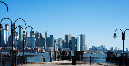 Modern buildings in city against clear sky