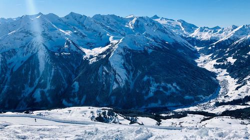 Scenic view of snowcapped mountains against sky