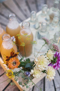 Bouquet of flowers near bottles