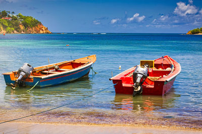 Boat moored on sea against sky. tropical beauty travel antilles