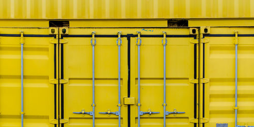 Close-up of yellow container 