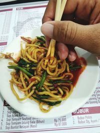Close-up of hand holding pasta