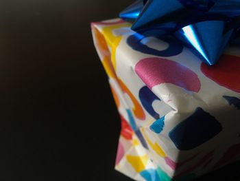 Close-up of multi colored pencils over black background