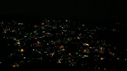 Illuminated cityscape at night