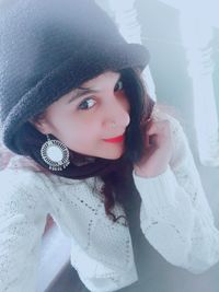 Portrait of a beautiful young woman in hat