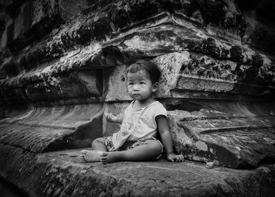 Girl sitting outdoors