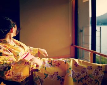 Woman sitting on table