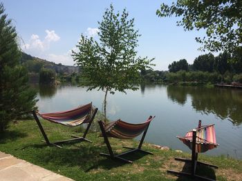 Scenic view of calm lake against blue sky