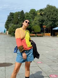 Smiling man standing on street