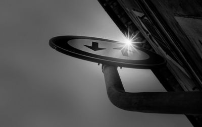 Low angle view of illuminated street light against sky