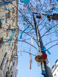 Low angle view of decorations on building against blue sky