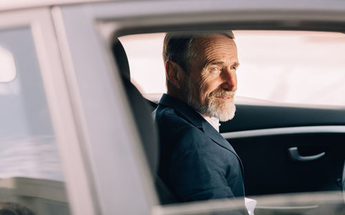 Portrait of man in car