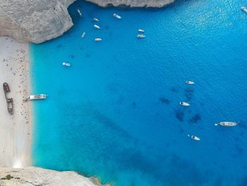 High angle view of sailboats on sea shore