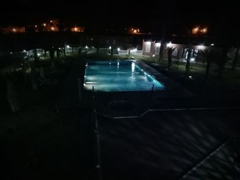 Swimming pool in city at night