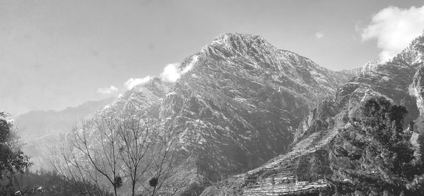 Panoramic view of snowcapped mountains against sky
