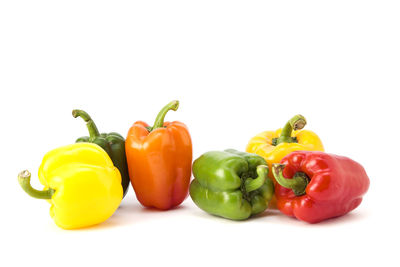 Close-up of bell peppers against white background