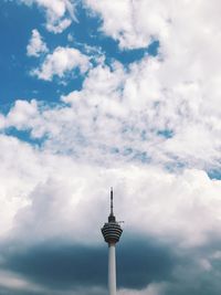 Low angle view of communications tower against sky